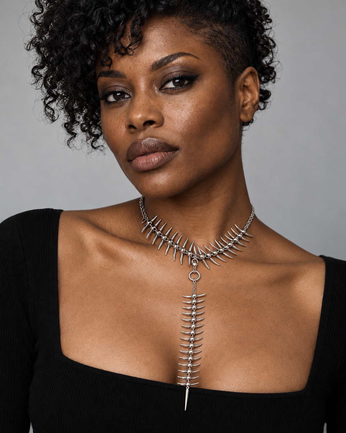 Scorthex Lariat Spine Necklace — worn by an adult AI model
