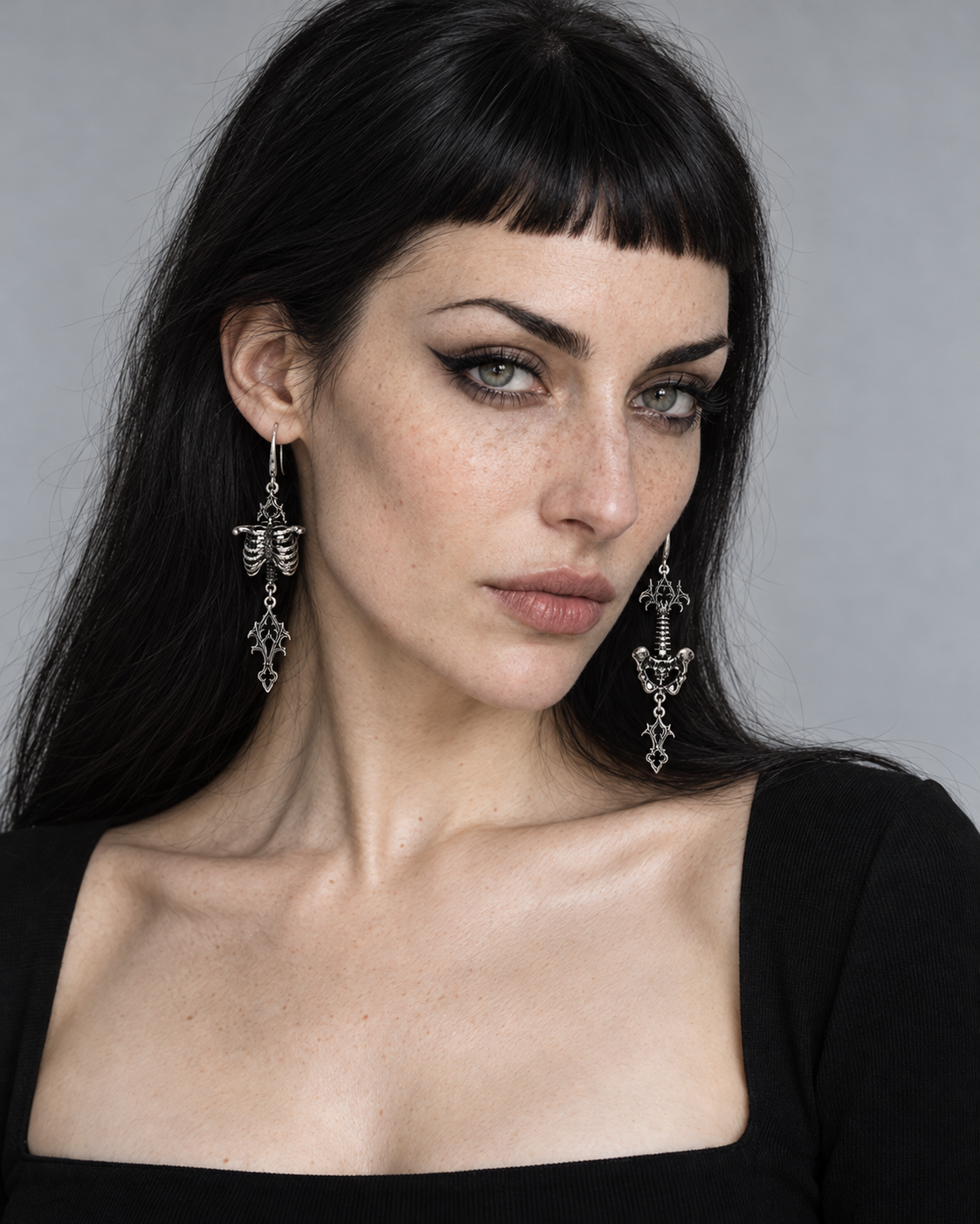 Quorin Skeleton Mismatch Earrings — worn by an adult AI model
