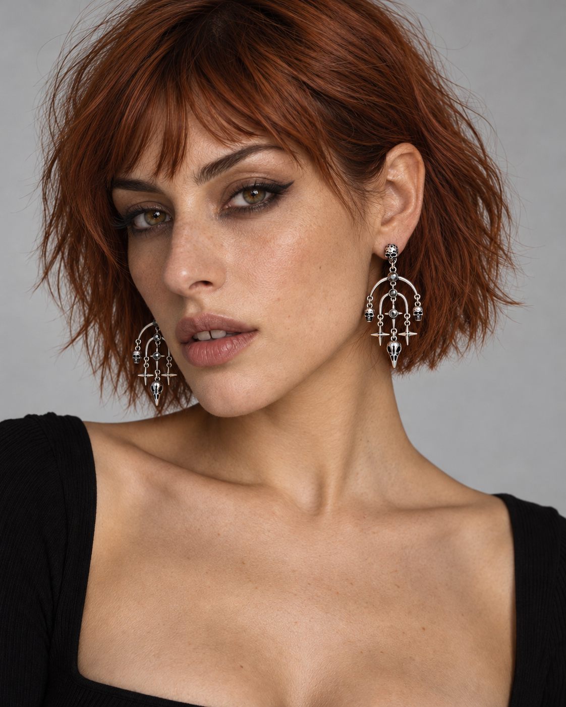 Corvus Skull Stud Drop Earrings — worn by an adult AI model