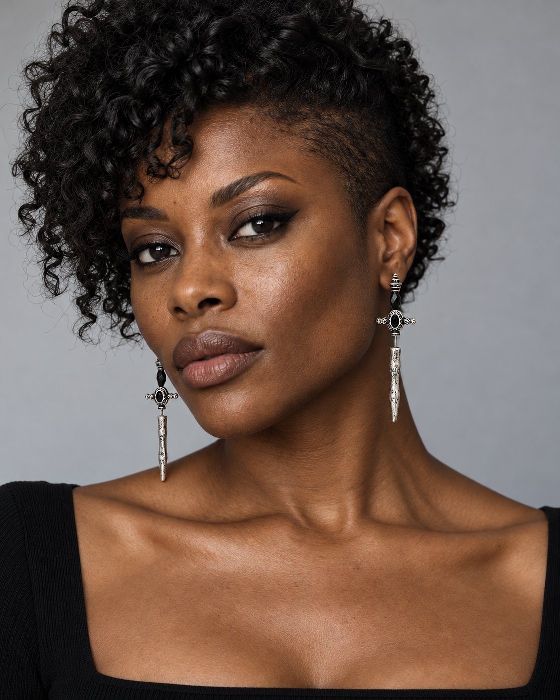 Eldun Sword Drop Earrings — worn by an adult AI model