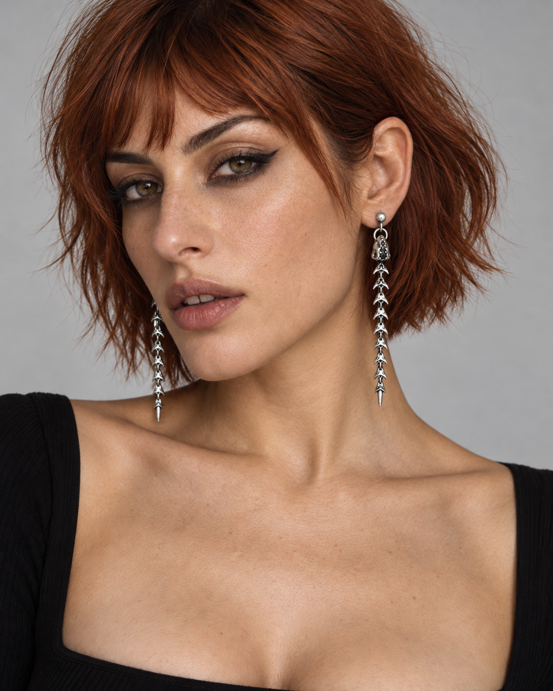Scorthex Snake Scale Earrings — worn by an adult AI model