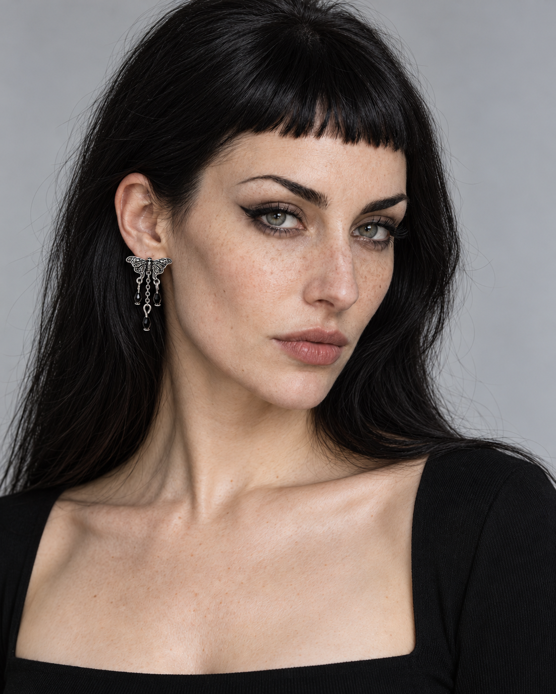 Rowan Moth Drop Earrings worn by an adult Noctimoth model