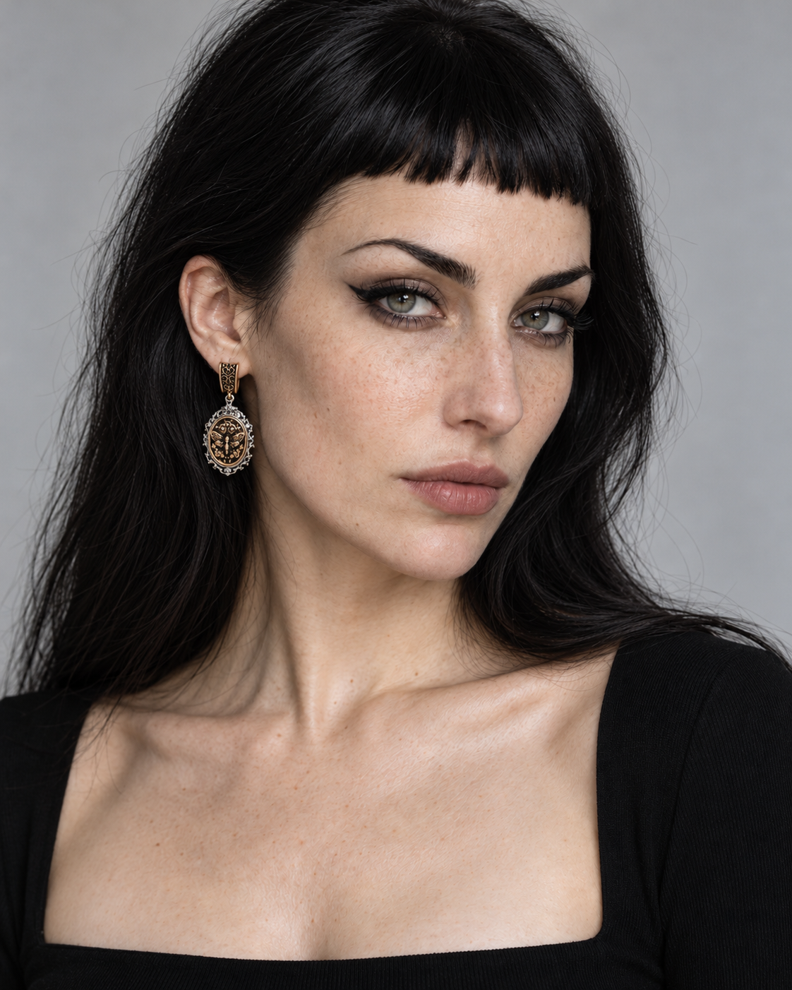 Rosamoth Cameo Drop Earrings worn by an adult Noctimoth model